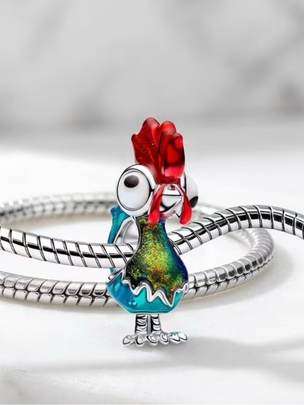 Red and Teal Rooster Hey Hey Charm from the Disney movie Moana. Adorabley cute.